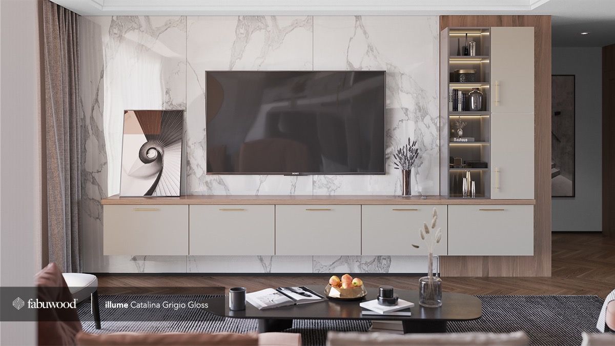 A modern living room with a marble accent wall, wall-mounted light gray cabinets, a flat-screen TV, and shelving.
