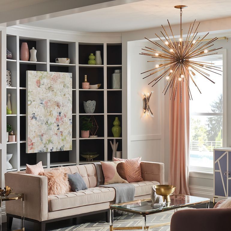 A living room with a couch and a chandelier