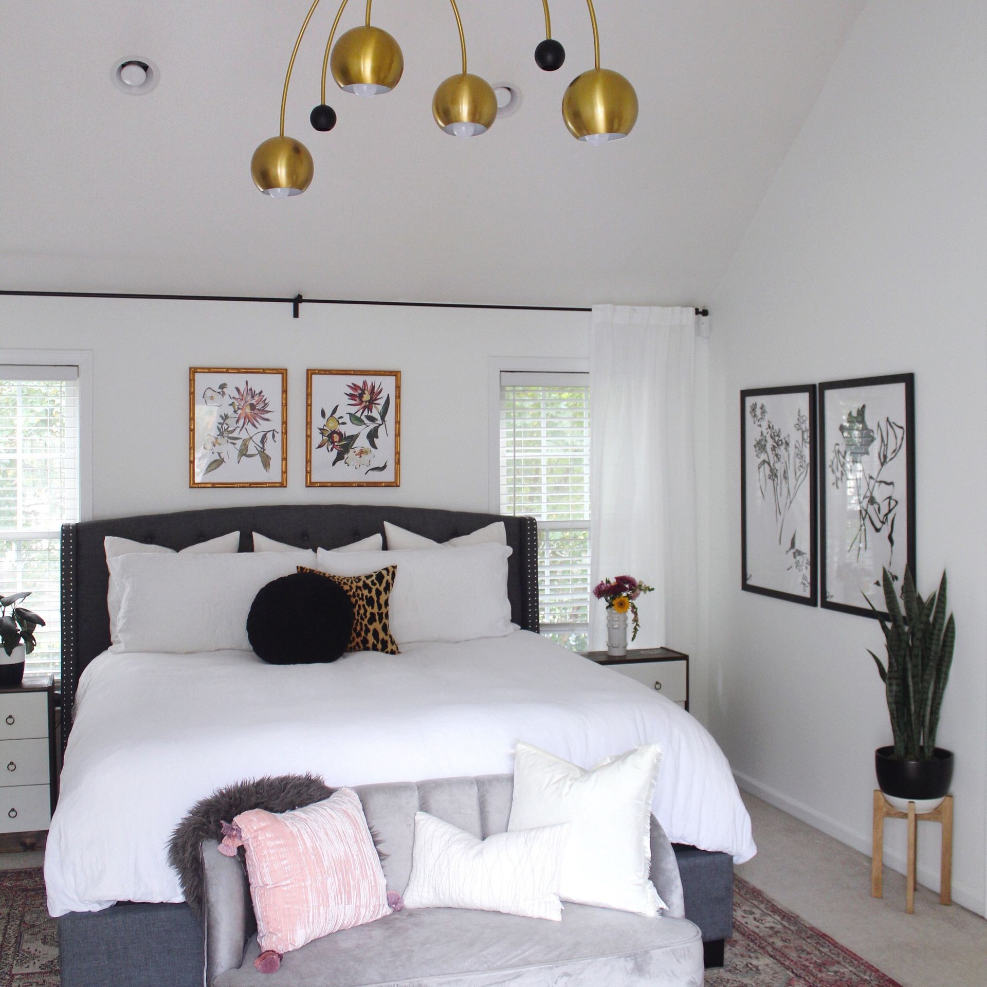 A bedroom with a large bed and a couch