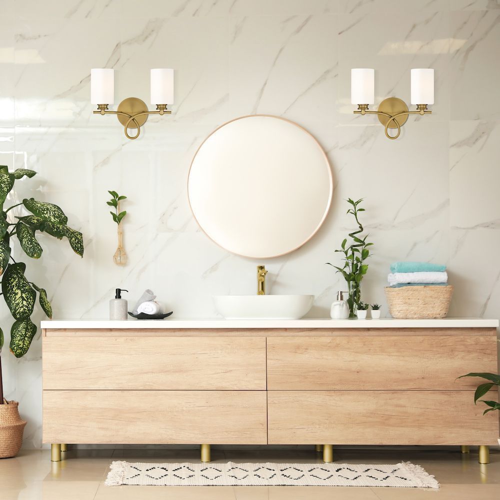 A bathroom with a sink and a mirror on the wall