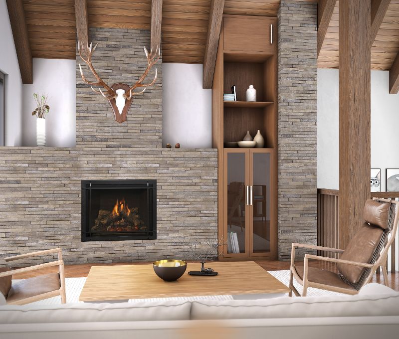 A living room with a fireplace and a deer head on the wall.