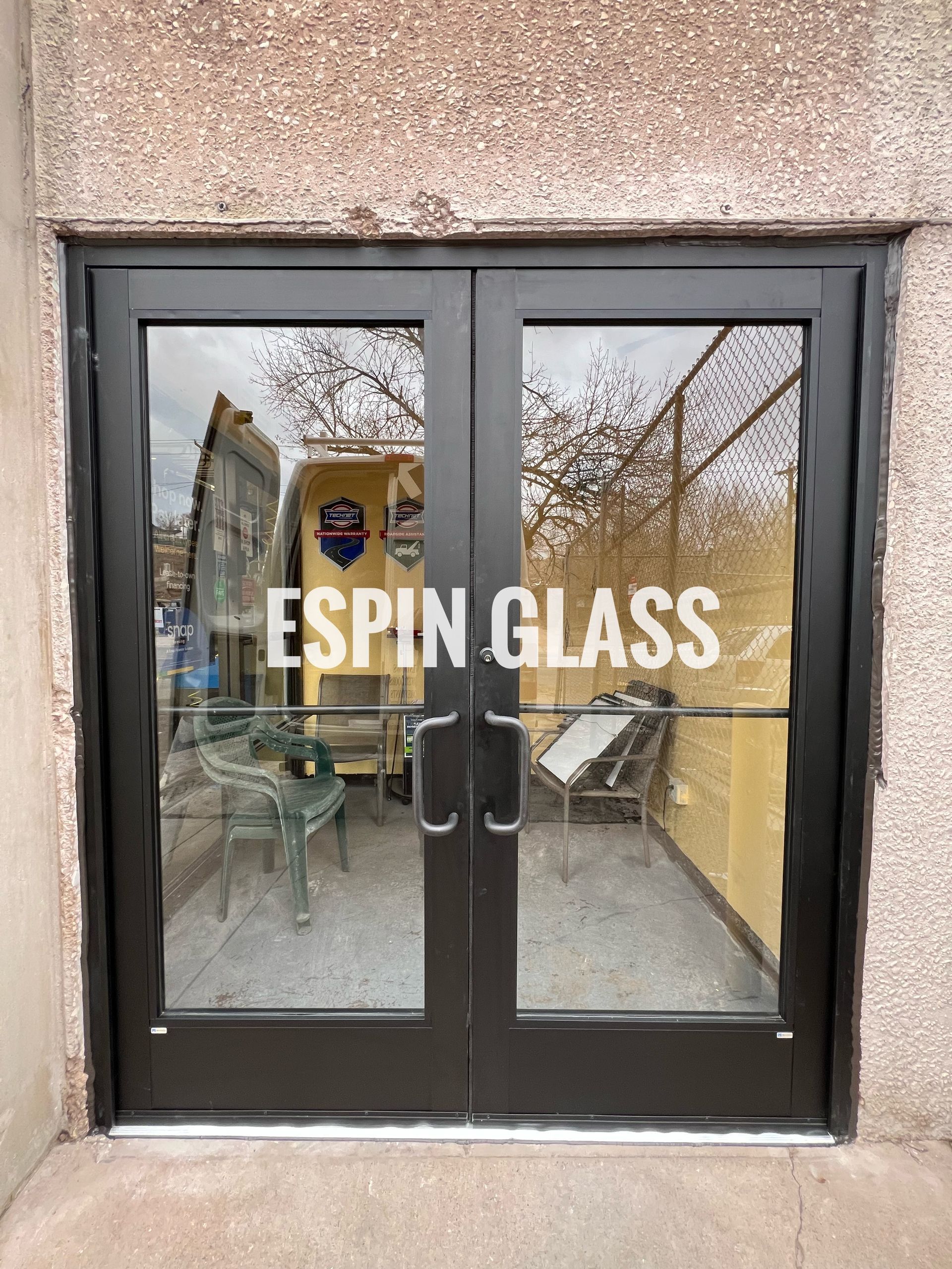 Double glass doors with black frames; 