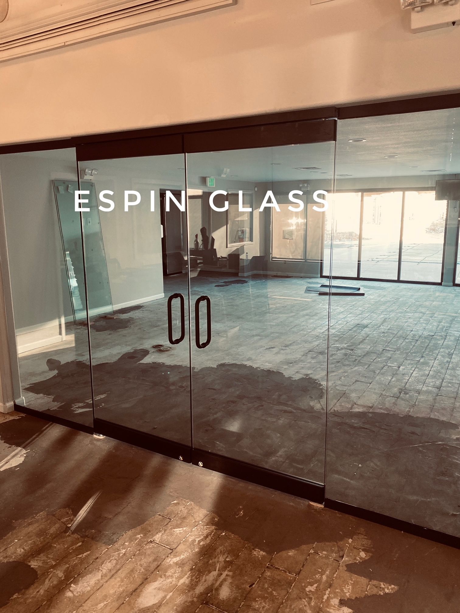 Glass doors with black handles and 