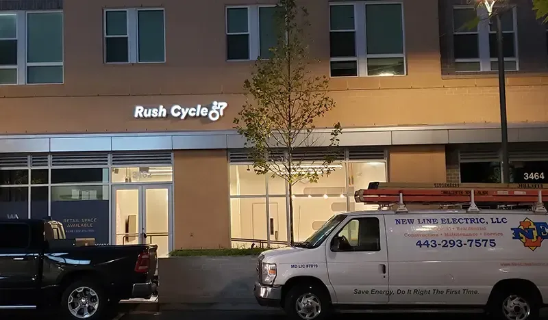 a van is parked in front of a building that says rush cycle