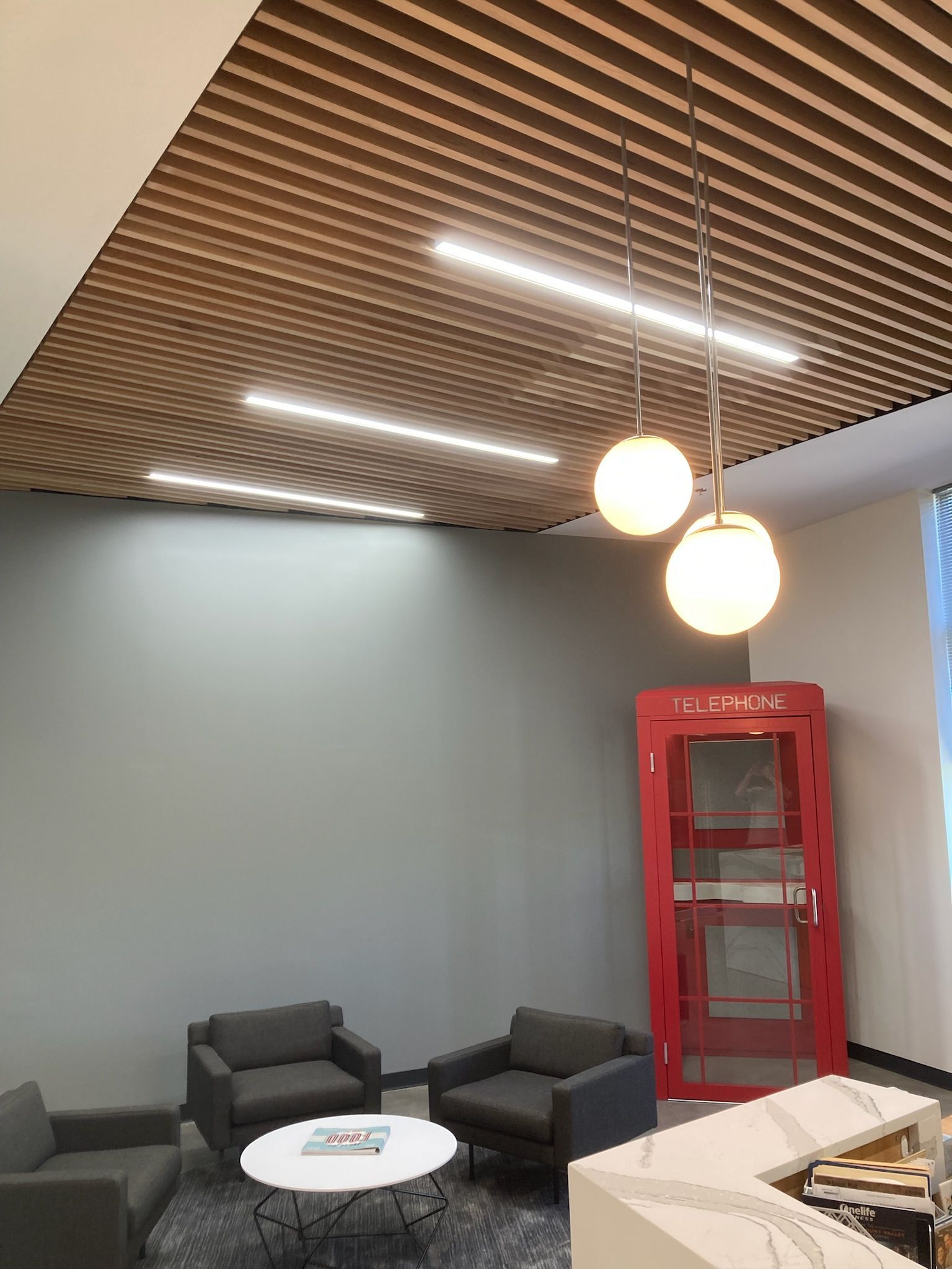 there is a red phone booth in the middle of the room