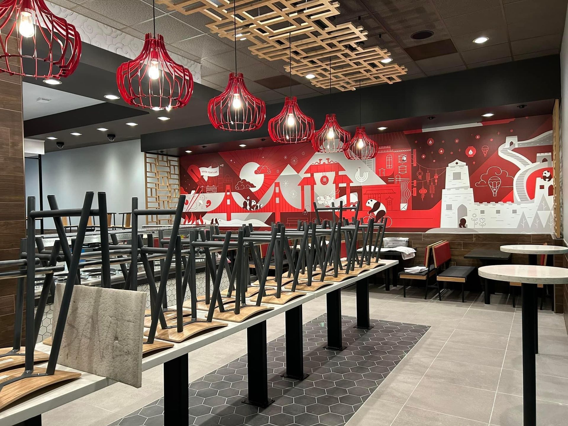 a restaurant with tables and chairs stacked on top of each other
