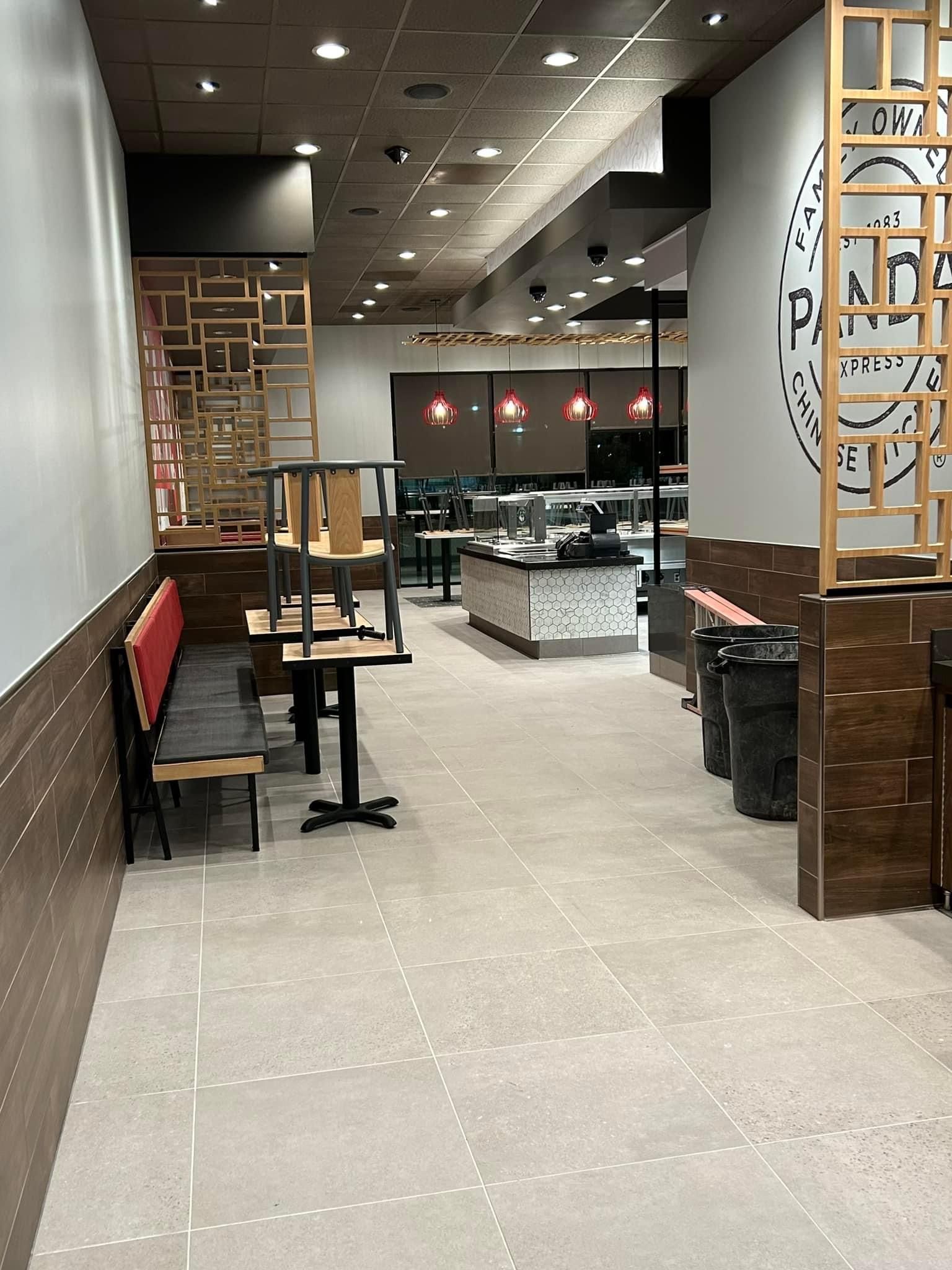 a restaurant with tables and chairs sitting on the floor