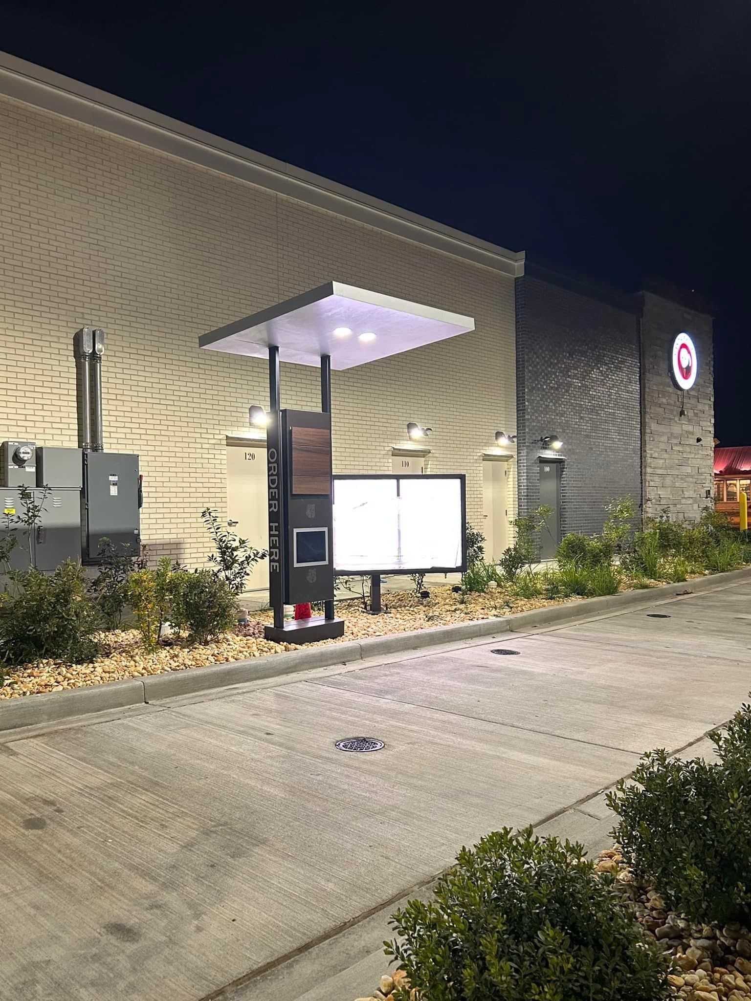 a drive thru at a fast food restaurant at night