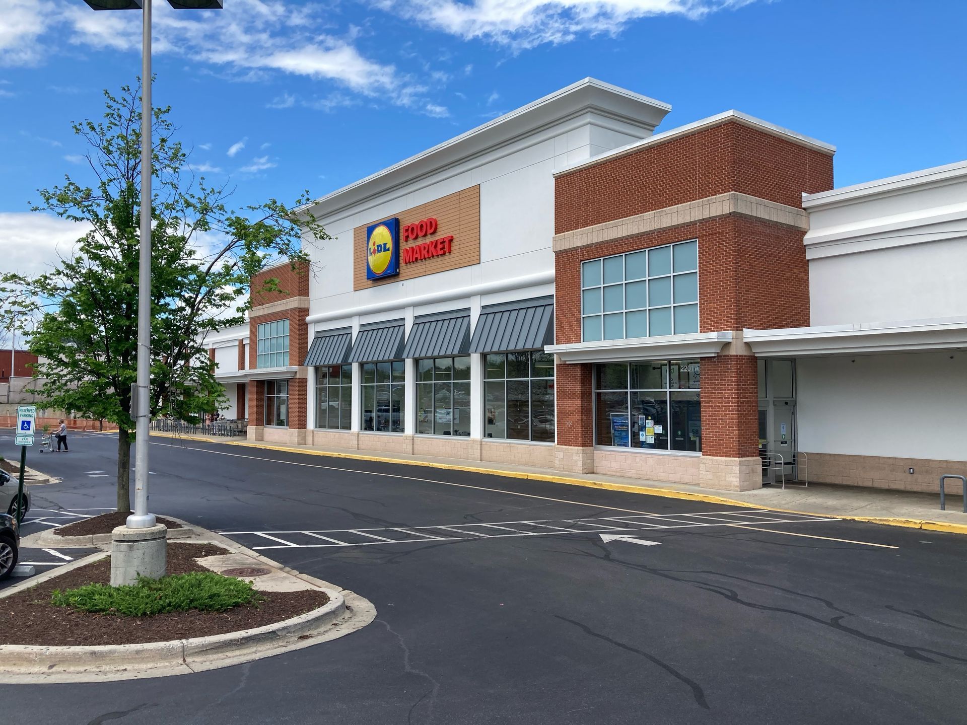 a large store with a lot of windows and a sign that says food court