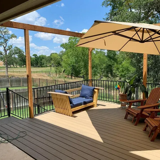 A wooden deck with a couch , chairs , and an umbrella.