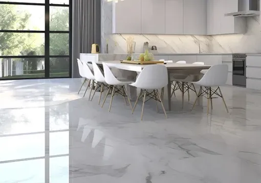 Bright modern kitchen and dining area with white chairs, marble floor, and large window reflections