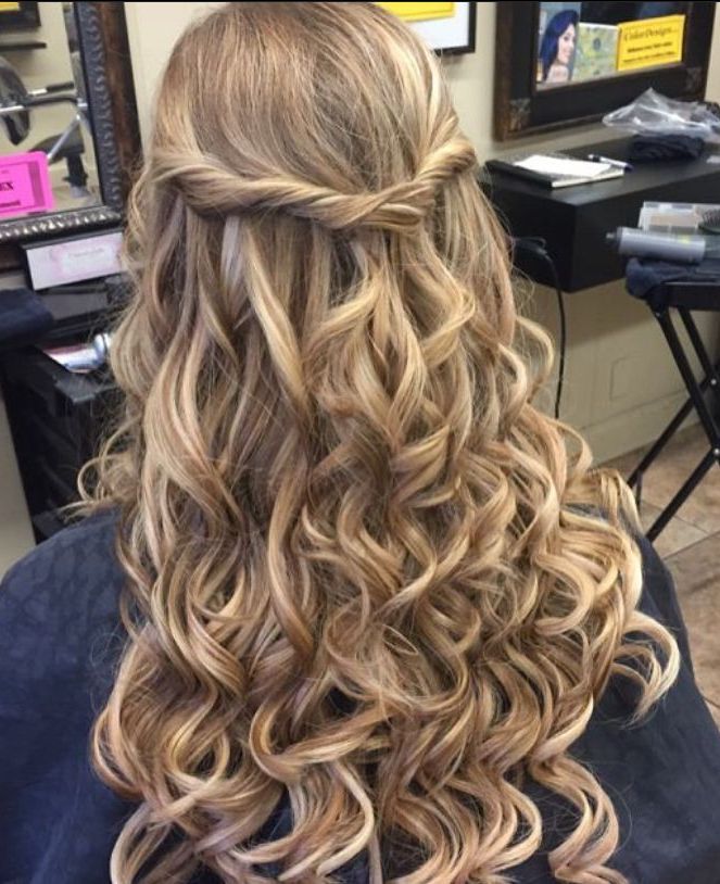 a woman is getting her hair done in a salon