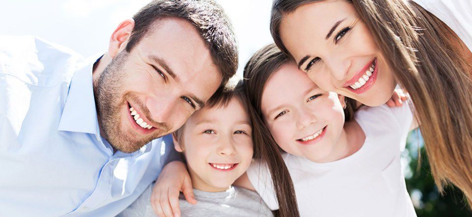 Family with healthy teeth