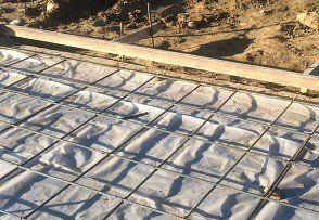 A close up of a concrete floor with a grid pattern.