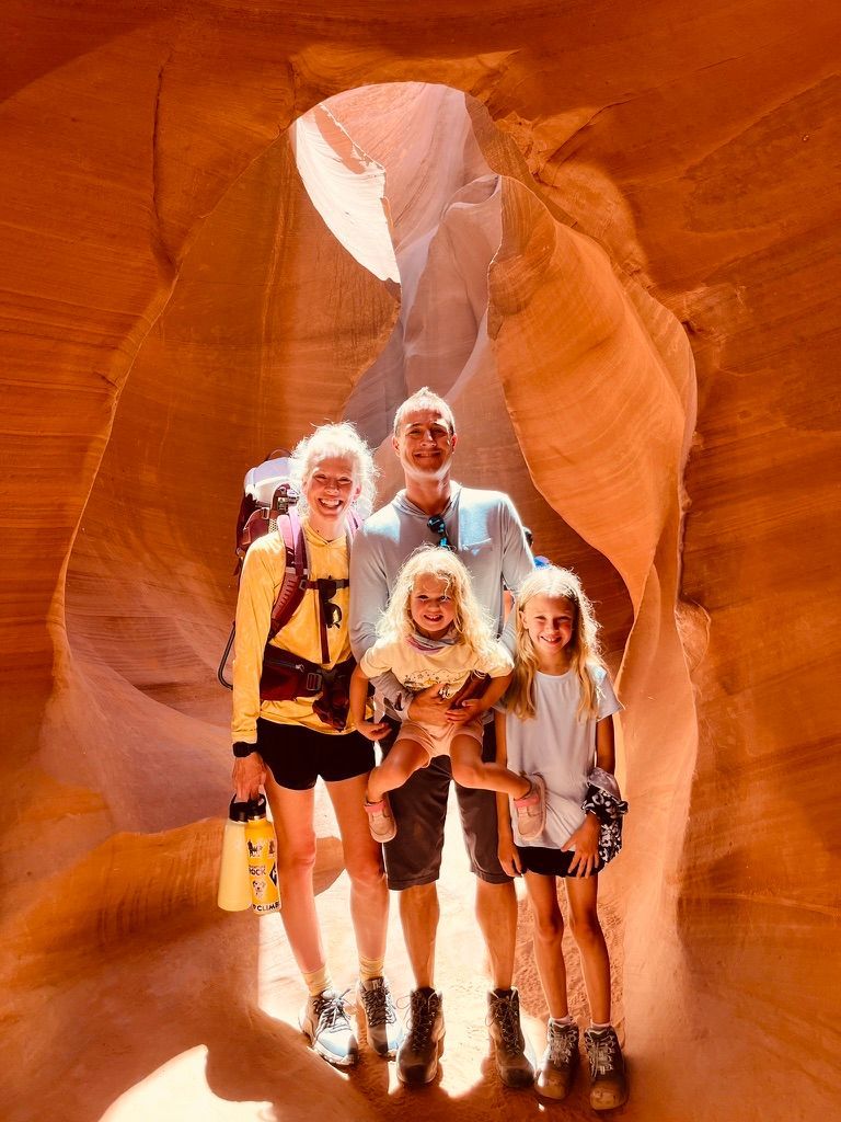 A family is posing for a picture in a canyon.