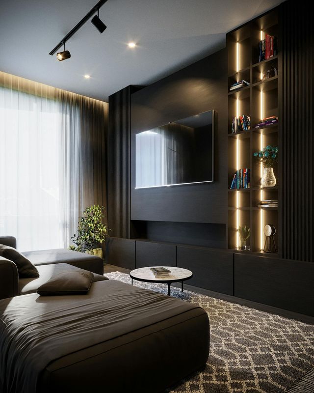 Modern bedroom with dark decor, wall-mounted TV, shelving, large window, and bed with gray bedding