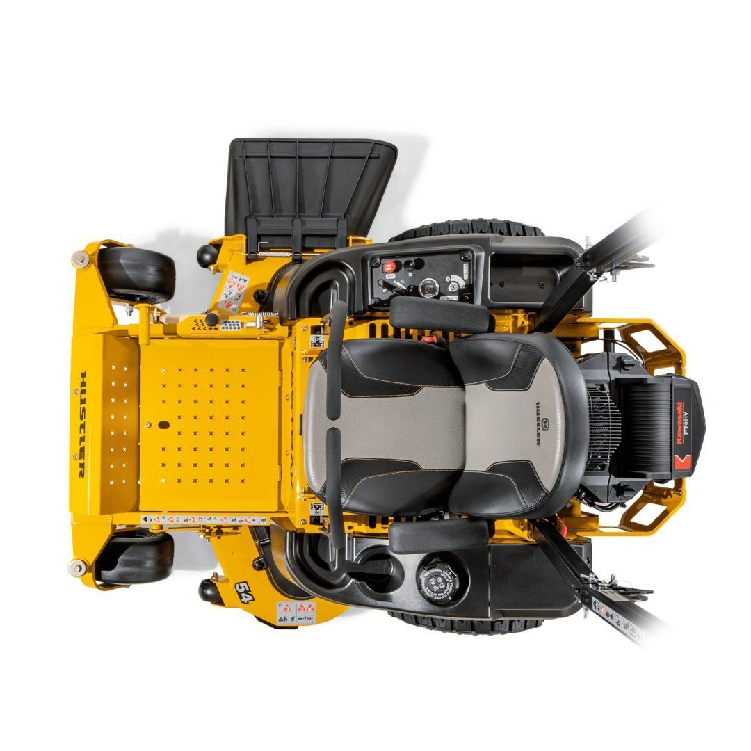 Top-down view of a yellow industrial floor-cleaning machine with black components and large tires
