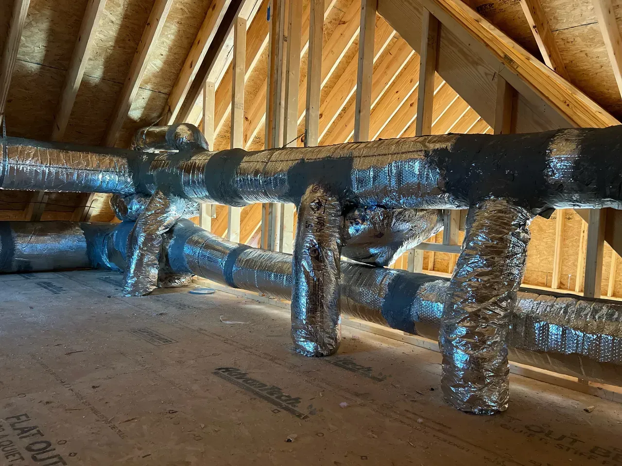 A room with a lot of pipes going through it