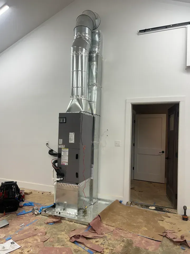 A room with a heater and a door in it.