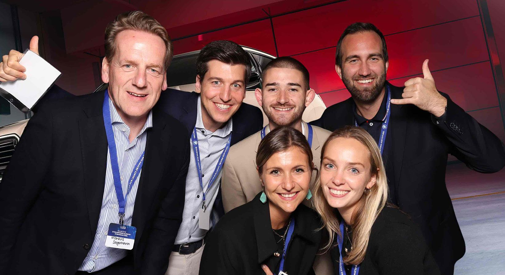 A group of people are posing for a picture in a photo booth