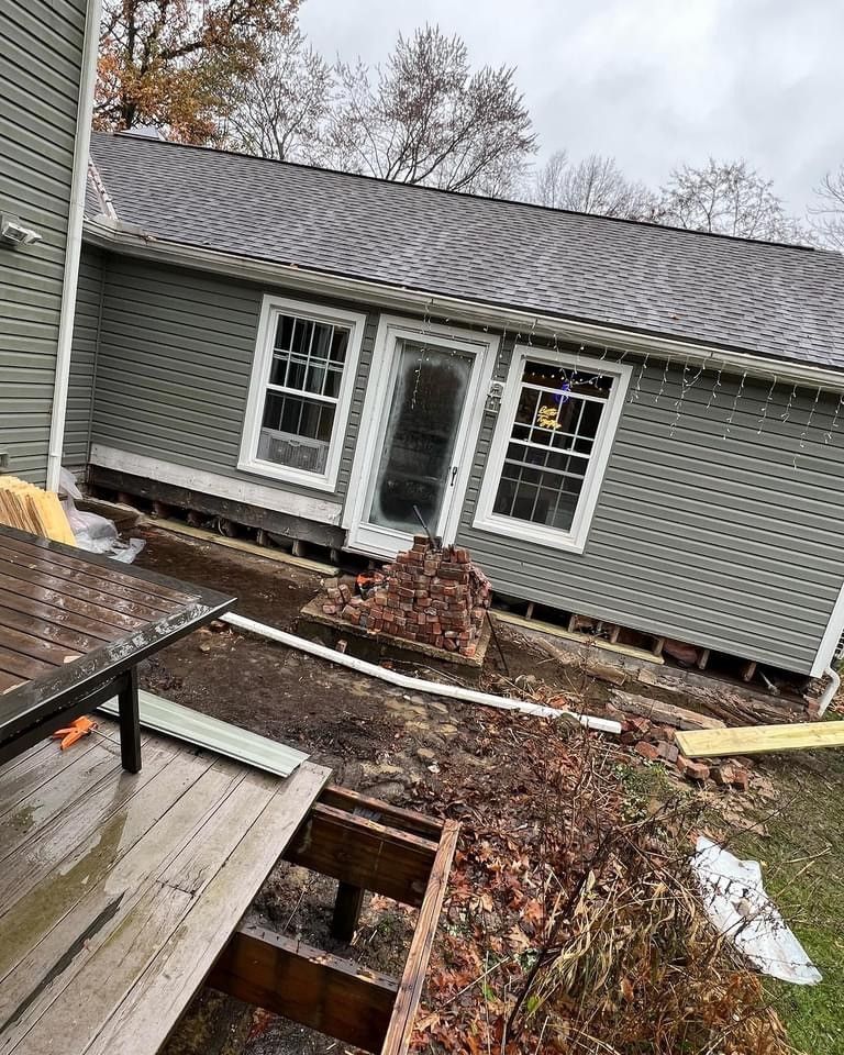 Pile of bricks in front of house