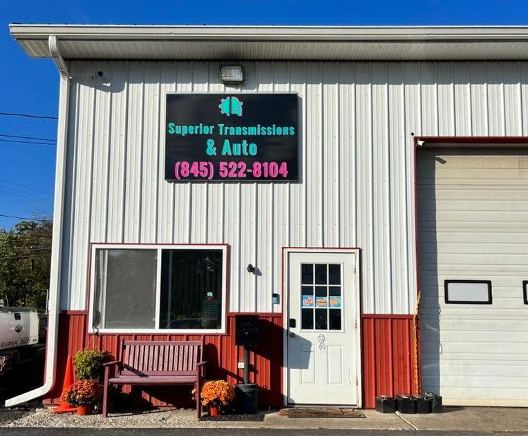 A building with a sign that says superior transmissions & auto