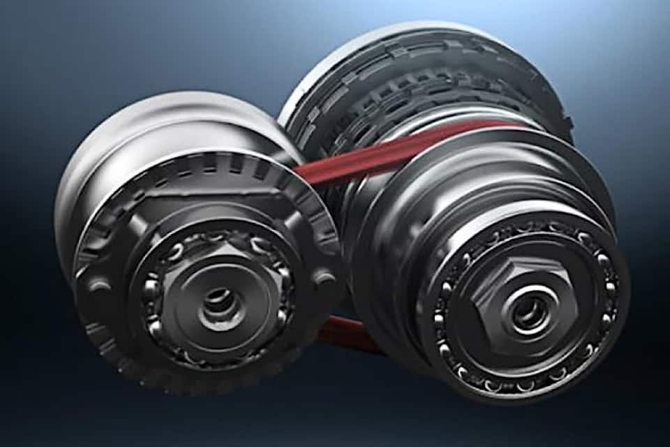A close up of a gear with a belt attached to it.
