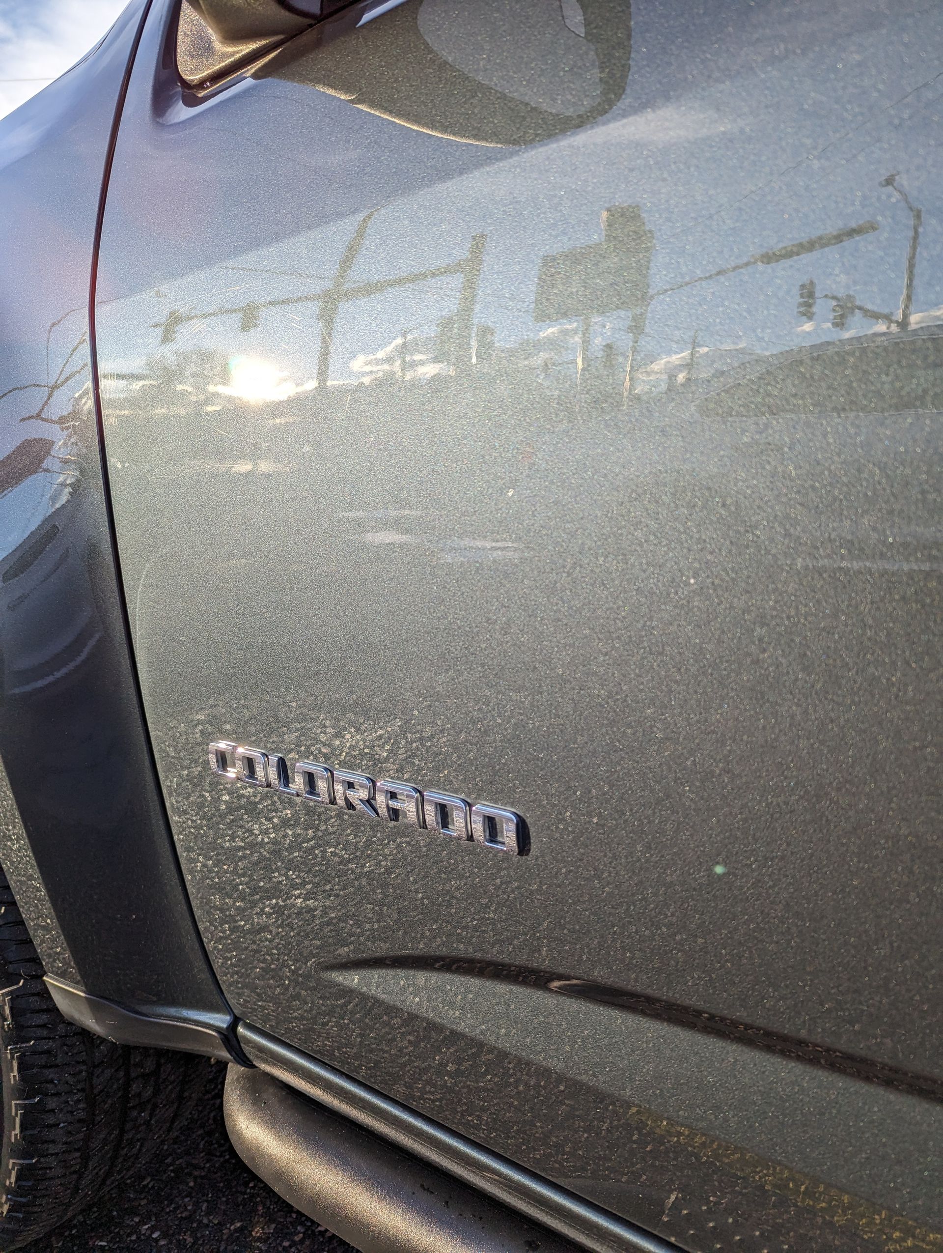 A close up of the side of a car with the word mission on it