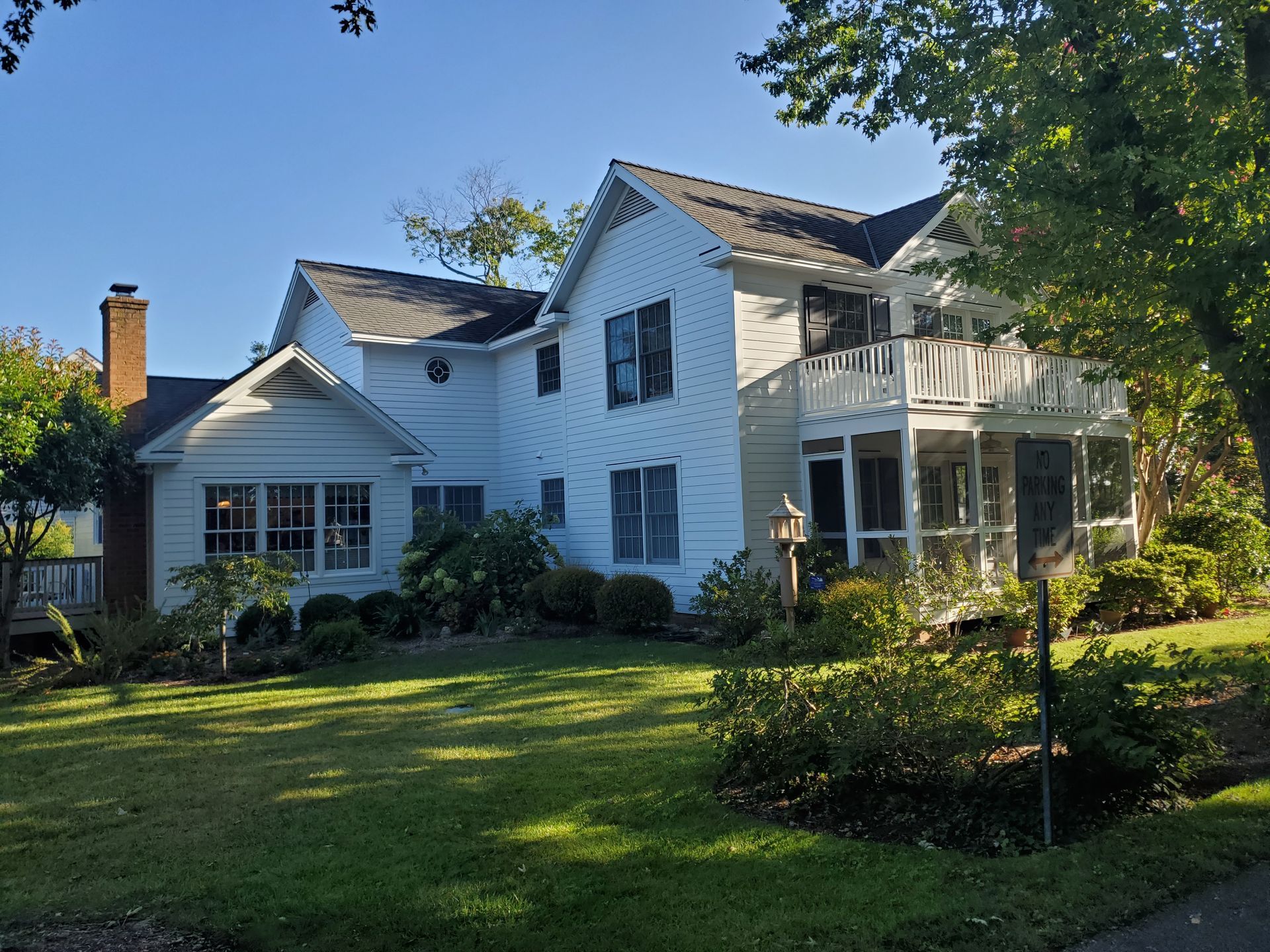 A large house with a professionally applied white paint job