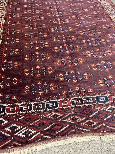 A close up of a rug with a pattern on it.