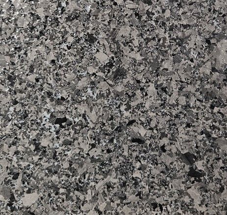 A close up of a granite counter top with a label on it.