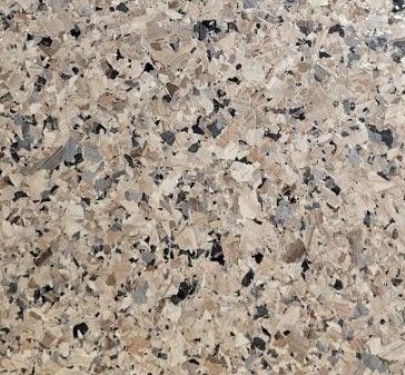 A close up of a granite counter top with a label that says quartz.