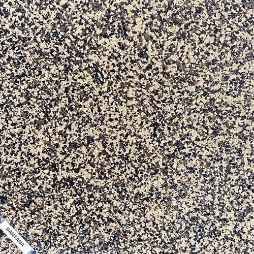 A close up of a rubber floor with a marker on it.