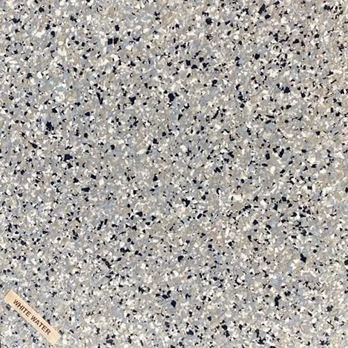 A close up of a gray and black granite counter top.