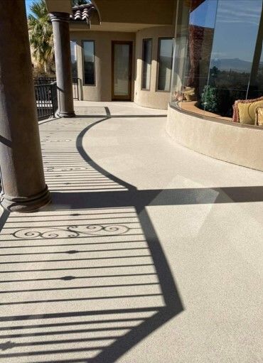 There is a shadow of a person on the floor of a house.