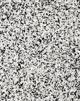 A close up of a black and white granite counter top.