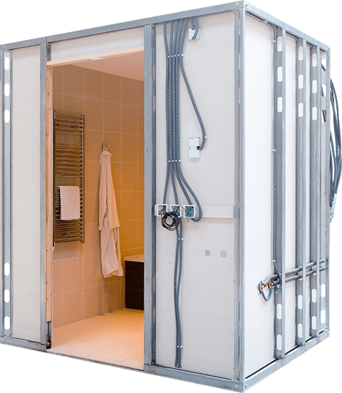 Metal-framed shower room with unfinished exterior showing wiring, open to a tiled bathroom with towel rack and robe.