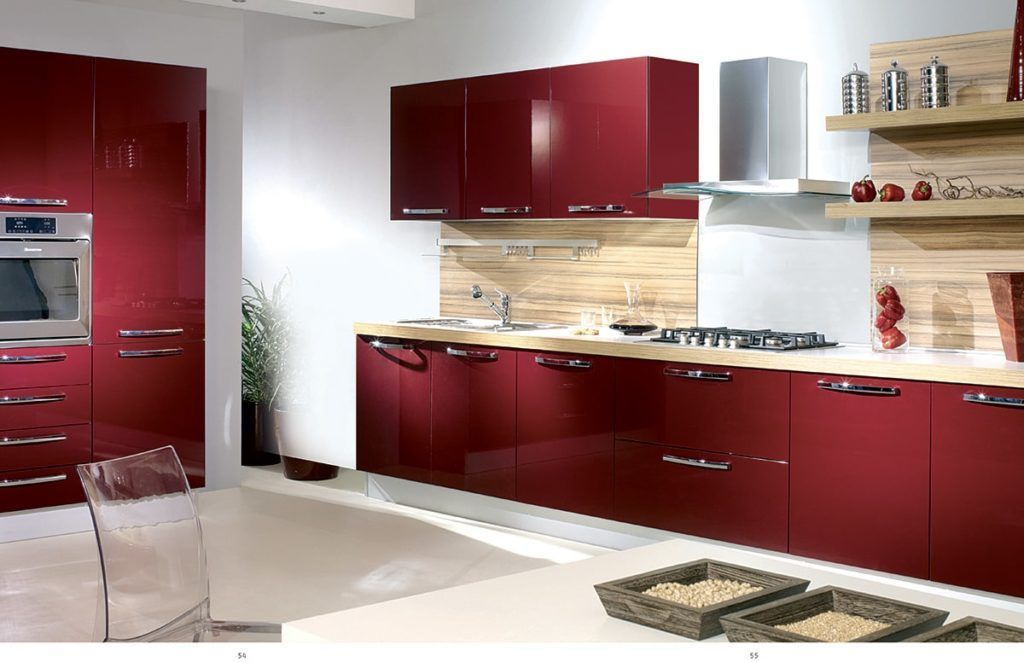Modern kitchen with red cabinets, stainless steel appliances, and wooden accents.