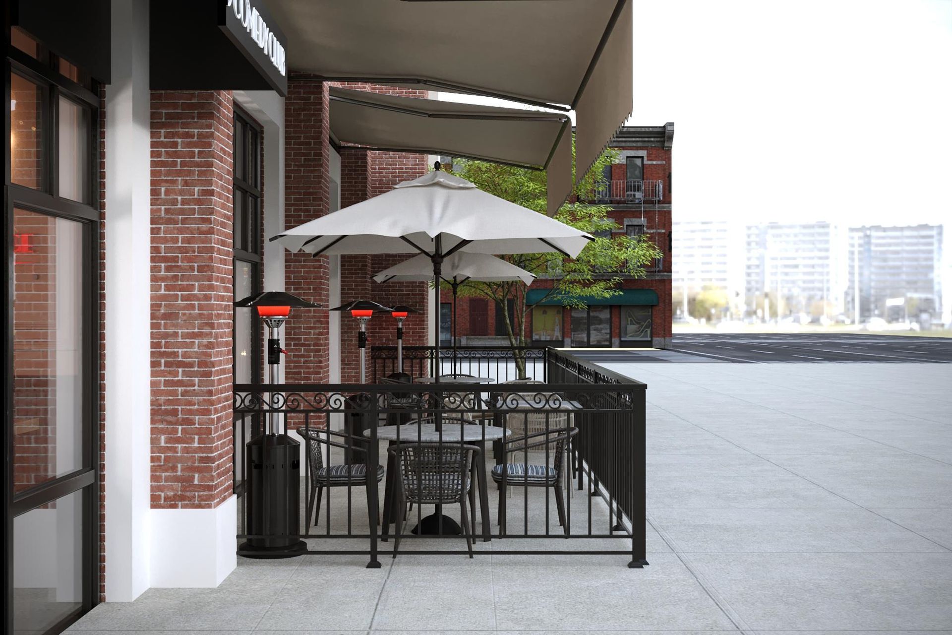 Outdoor cafe seating with tables, umbrellas, and brick building facade.