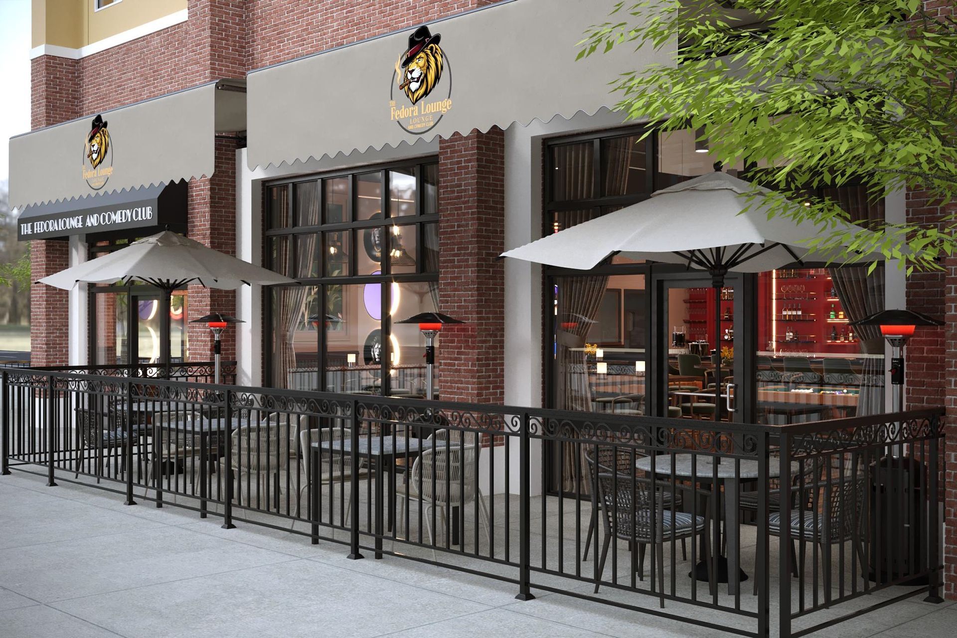 Restaurant patio with black tables, umbrellas, and heaters, enclosed by black railings. Building has awning and large windows.