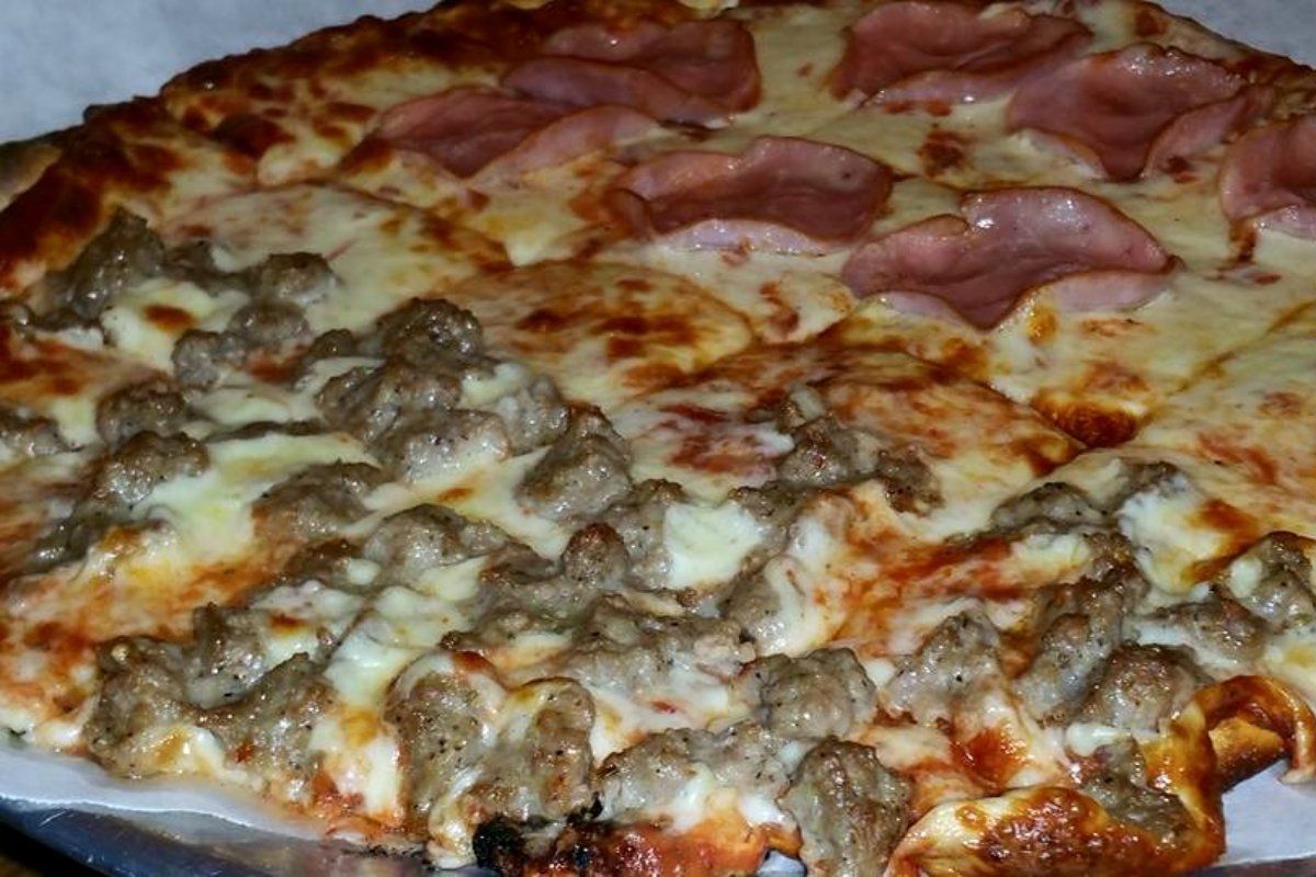 Pizza with sausage and ham toppings.
