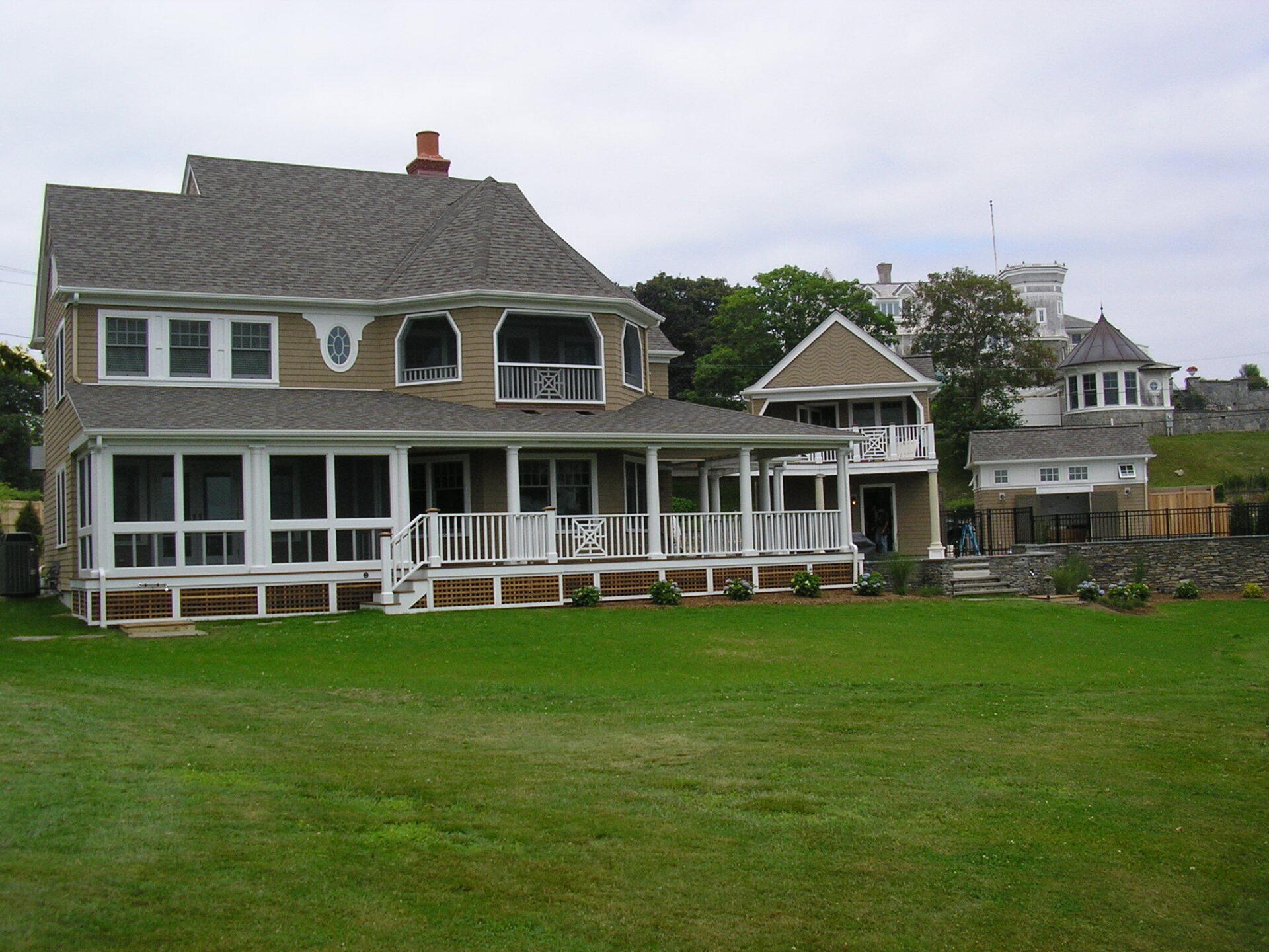 A large house with a large screened in porch