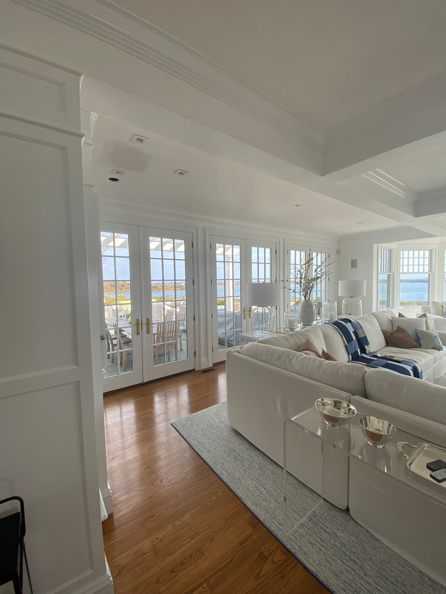A living room filled with furniture and a lot of windows.
