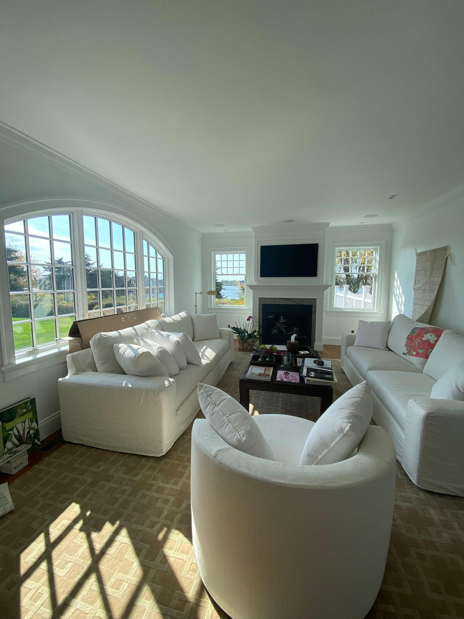 A living room filled with furniture and a fireplace.