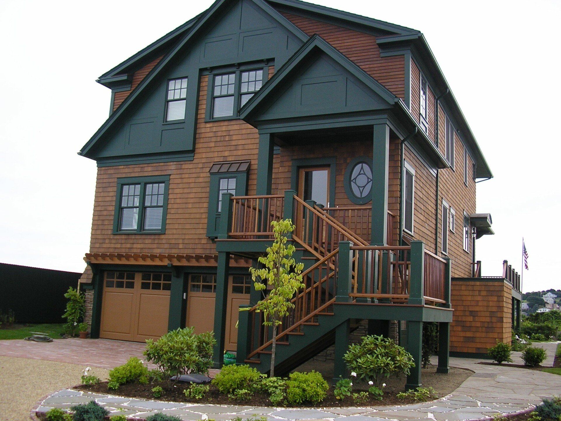 A large house with stairs leading up to the front door