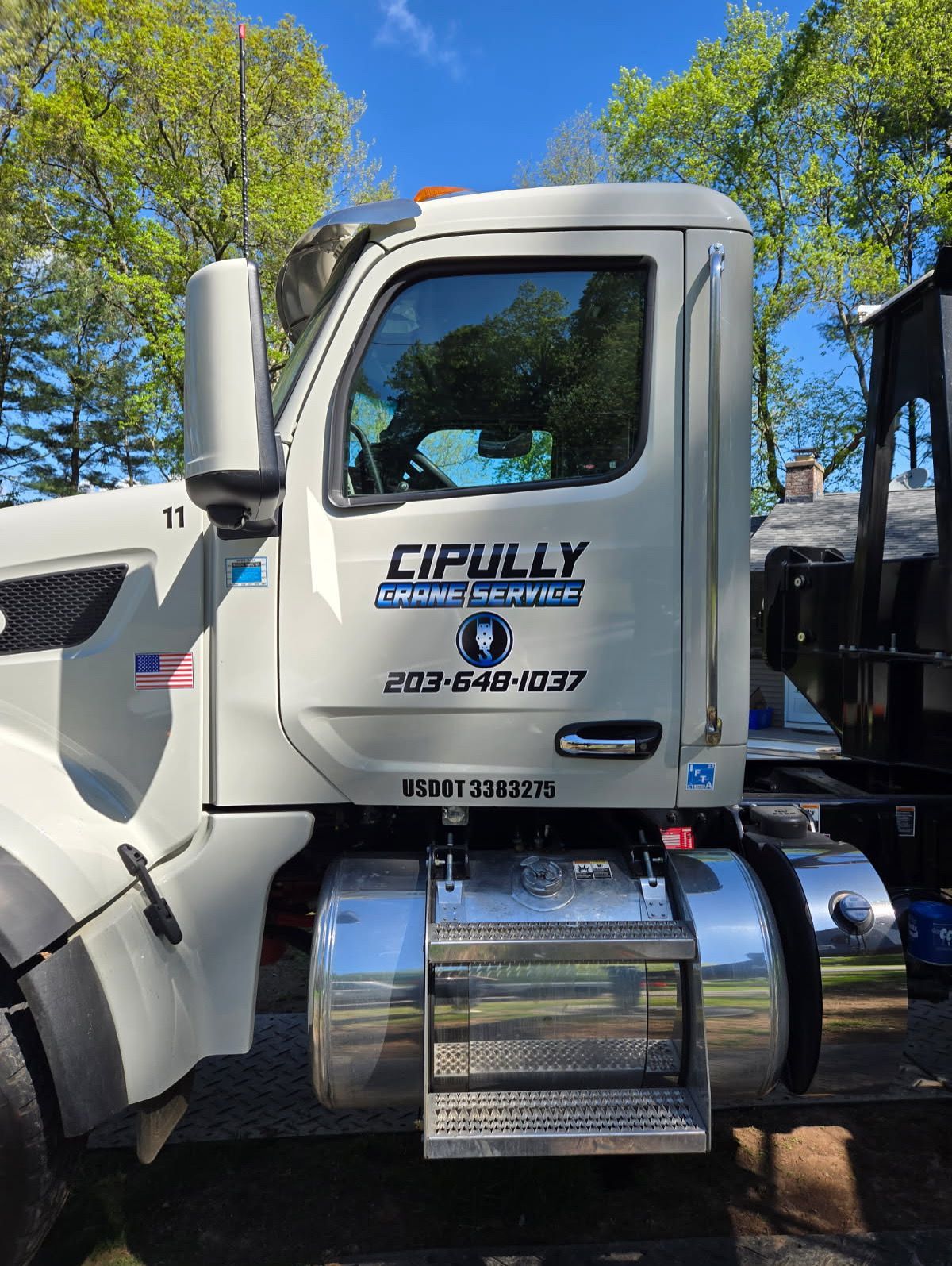 A white truck with the word cipully on the side is parked in a parking lot.