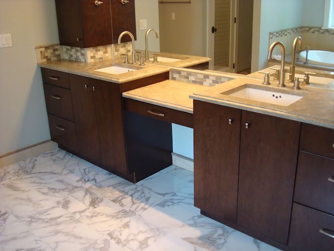 A bathroom with two sinks and two mirrors