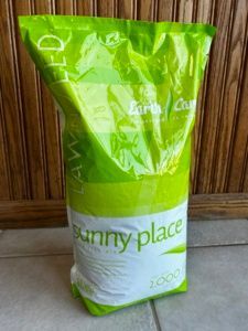 A bag of sunny place is sitting on a tiled floor