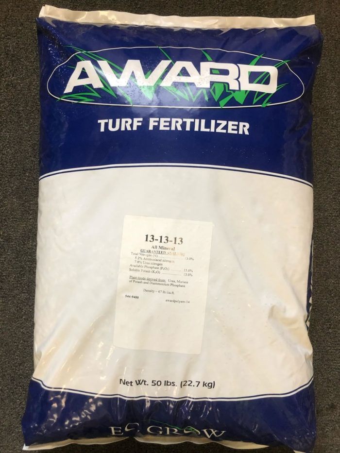 A blue and white bag of award turf fertilizer