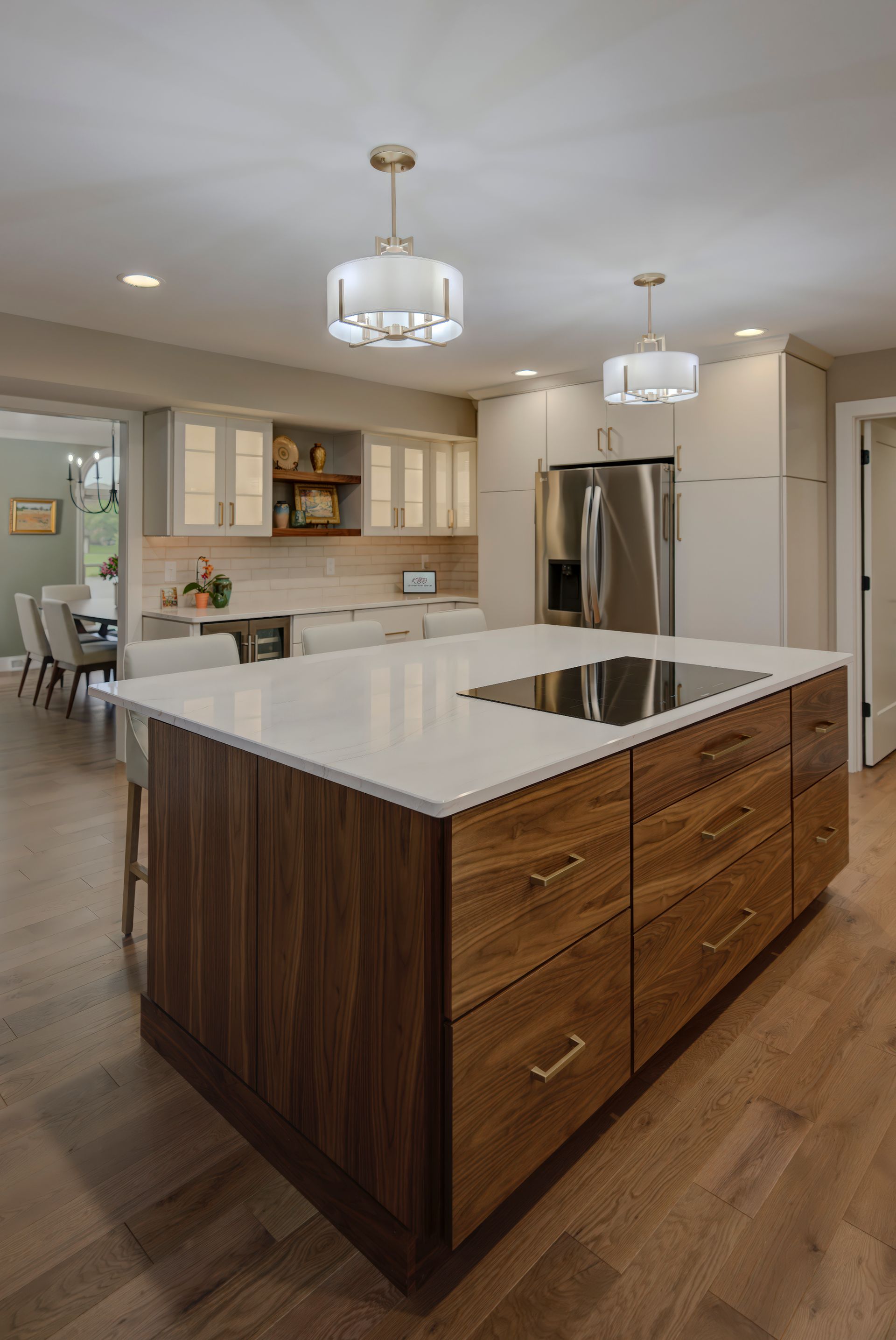 A kitchen with a large island and stainless steel appliances.